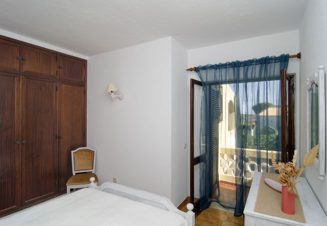 Bedroom with double bed Bedroom with double bed and balcony in Villa Beatriz