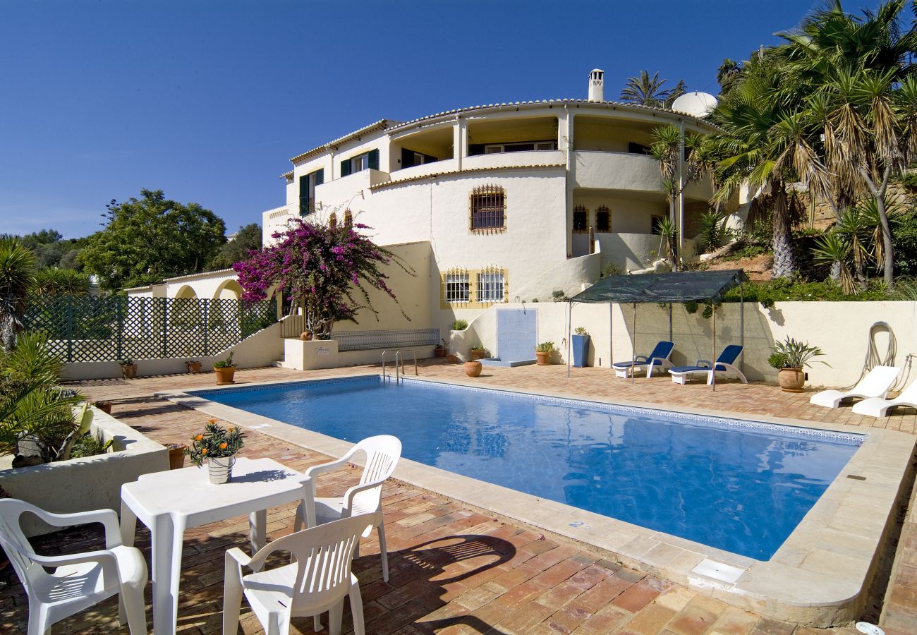 large pool with spacious terrace large pool surrounded by a spacious pool terrace with outdoor shower in front of the three-story Villa Lorena